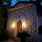 Wall lamps frame door of rustic spanish style building