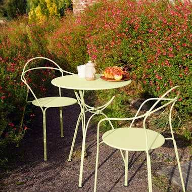 Designer outdoor table and chairs in garden