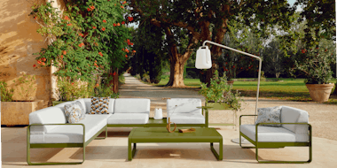 Outdoor modular lounge in green with white cushions