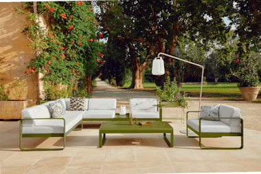 Outdoor modular lounge in green with white cushions