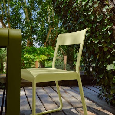 Outdoor chair with outdoor dining table on deck