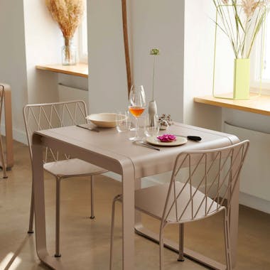 Metal dining table and chair with detail back design