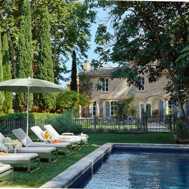 Bellevie sunloungers by pool at chateau