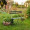 Folding metal bench set in garden