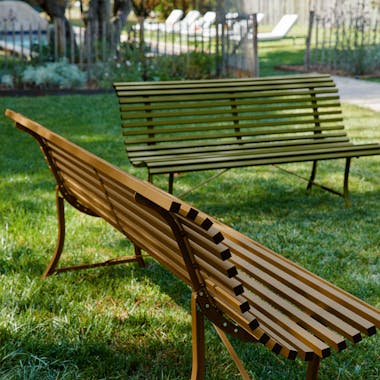 Garden benches is earthy natural colours on grass