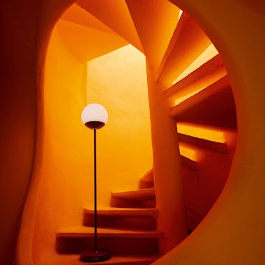 Portable lamp in curving stairwell