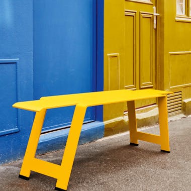 Minimalist metal bench in yellow