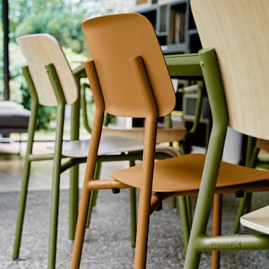 Dining chairs in green and brown with timber seat