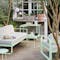 Bellevie outdoor sofa and Luxembourg bar trolley from Fermob in Ice Mint