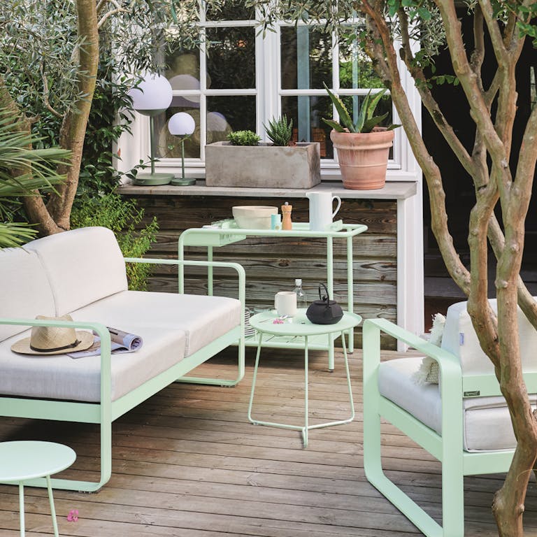 Bellevie outdoor sofa and Luxembourg bar trolley from Fermob in Ice Mint