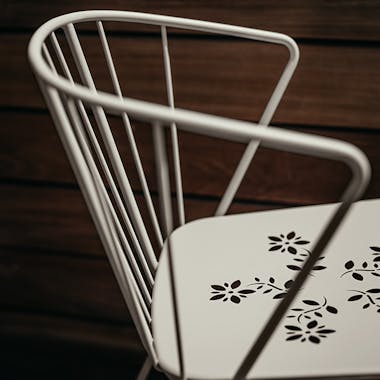 Closeup of Flower metal chair in Clay Grey