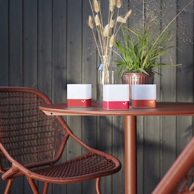 Fermob Flower metal table and Sixties chairs in Red Ochre