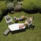 Outdoor chairs and coffee table on grass