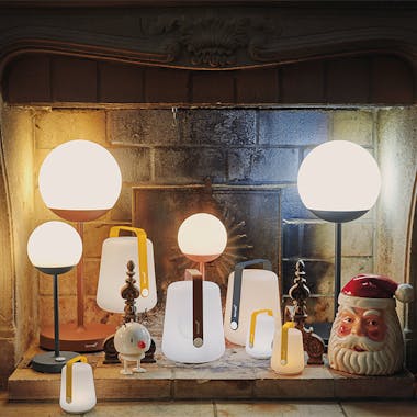Fermob Balad and Mooon! lamps in Christmas fireplace
