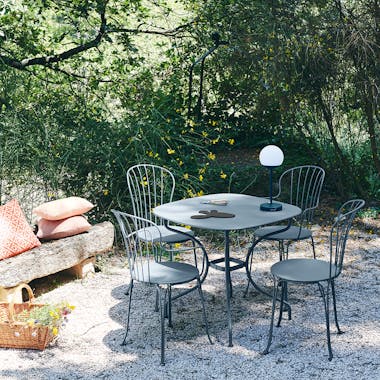 Opera+ collection from Fermob in gravel garden