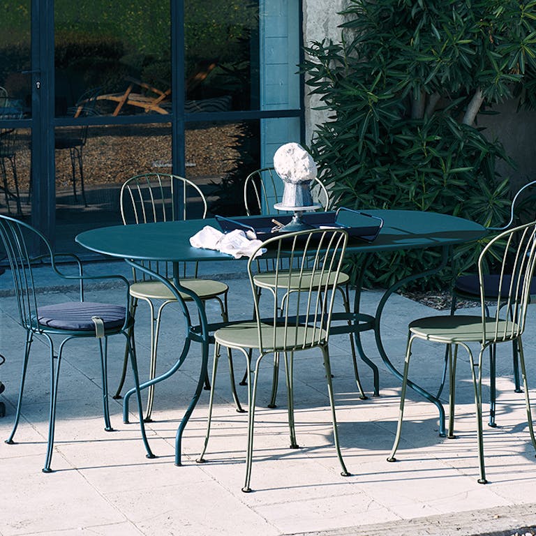 Fermob Opera+ Oval Table and Chairs in Courtyard