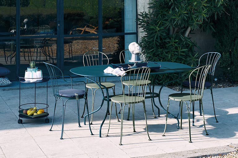 Fermob Opera+ Oval Table and Chairs in Courtyard