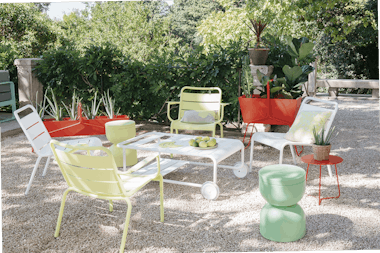 Luxembourg lounge armchairs in pebble courtyard