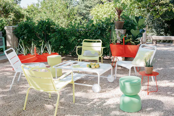 Luxembourg lounge armchairs in pebble courtyard