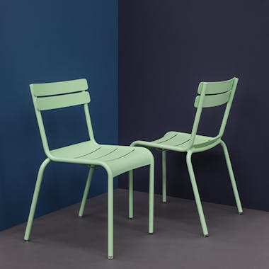 Studio shot of Fermob Luxembourg dining chairs in Opaline colour
