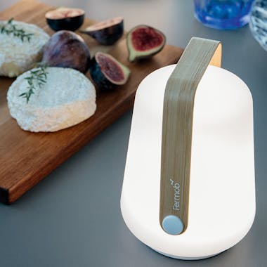 Fermob mini Balad lamp with bamboo handle by a tray of figs
