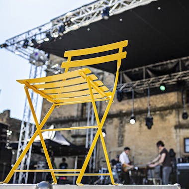 Fermob bistro folding chair in honey on stage