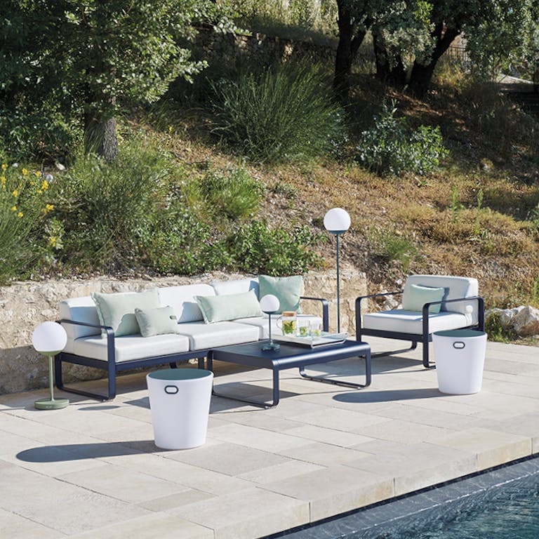 Three seater outdoor sofa with coffee table poolside