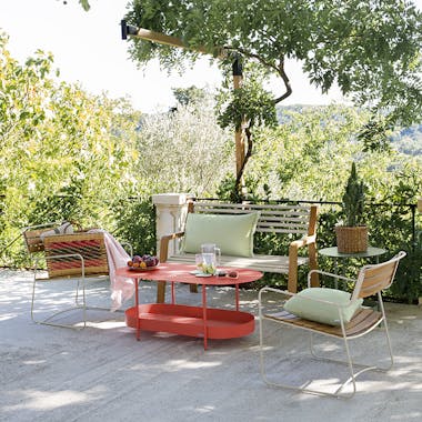Garden bench and casual chairs on an outdoor terrace