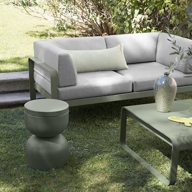 Fermob Bellevie Club 2 seater sofa in garden with low table