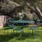 Fermob 1900 outdoor table and chairs in garden