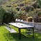 Fermob Ribambelle Extending table with Surprising outdoor chairs in garden