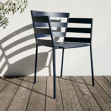 Fermob metal armchair in deep blue in the sun