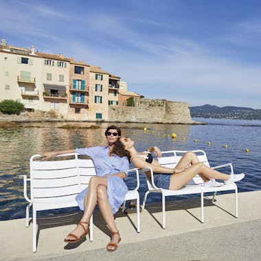 Fermob luxembourg low armchairs at the waterside in St Tropez