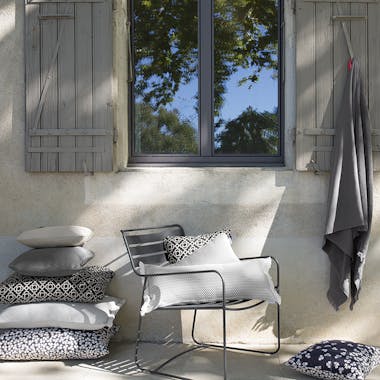 Outdoor cushions in dark tones from Fermob