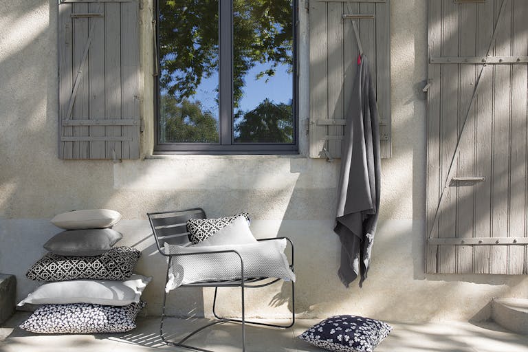 Outdoor cushions in dark tones from Fermob