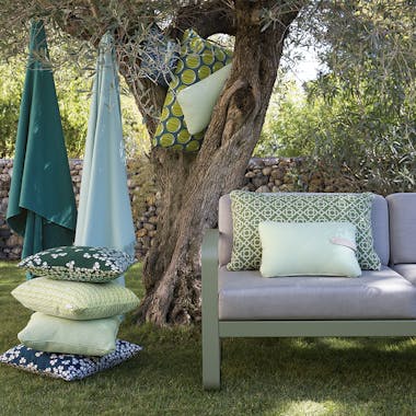 Fermob outdoor cushions in a garden