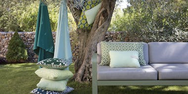 Fermob outdoor cushions in a garden