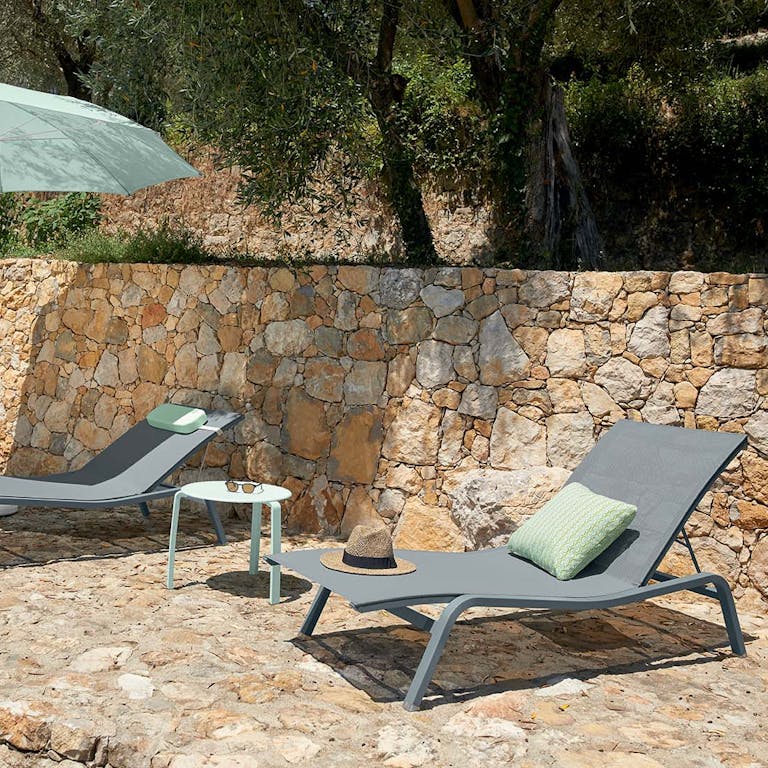 Fermob Alize sunloungers poolside with Shadoo parasol