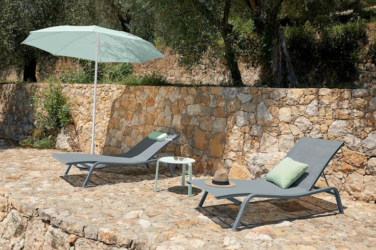 Fermob Alize sunloungers poolside with Shadoo parasol