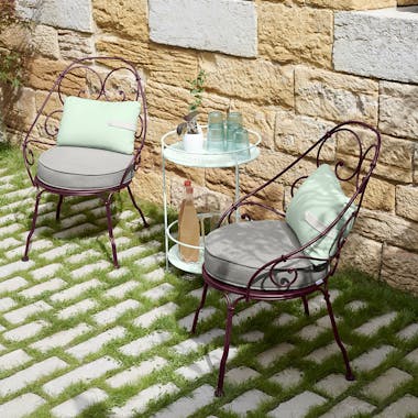 Fermob 1900 Cabriolet armchairs in courtyard