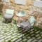 Fermob 1900 Cabriolet armchairs in courtyard