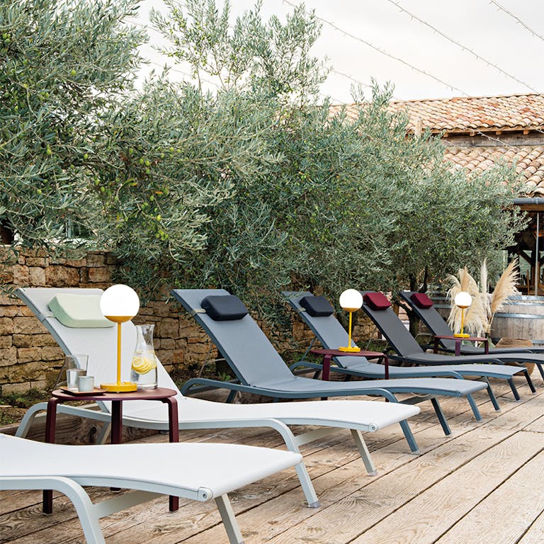 Fermob Alize sunloungers in a row