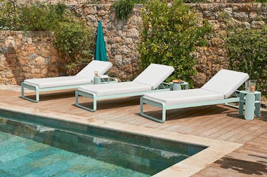 Fermob Bellevie sunlounger by pool
