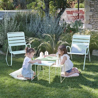 Children playing at Fermob Oulala nesting outdoor tables