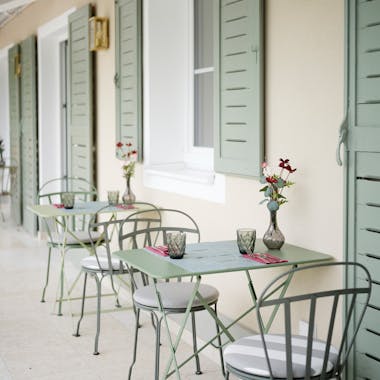 Fermob Louvre chairs on terrace at Villa Ivy