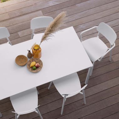 Fermob Calvi outdoor table with Studie outdoor chairs and armchairs on deck