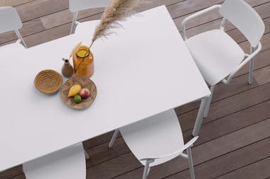 Fermob Calvi outdoor table with Studie outdoor chairs and armchairs on deck
