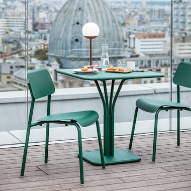 Fermob Studie chair and Luxembourg pedestal table on roof terrace