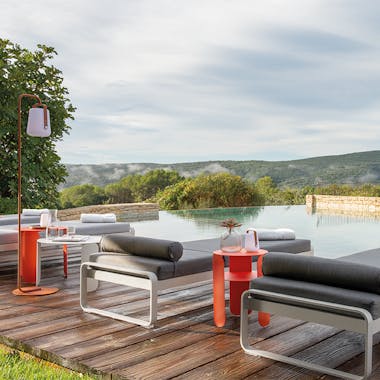 Fermob Bellevie sunloungers poolside at boutique hotel