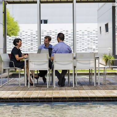 Fermob Calvi outdoor table and Cadiz chairs on office deck